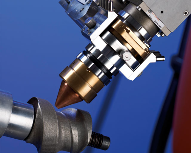 Robot with COAX powder nozzle for build-up welding (repair) of an extruder screw