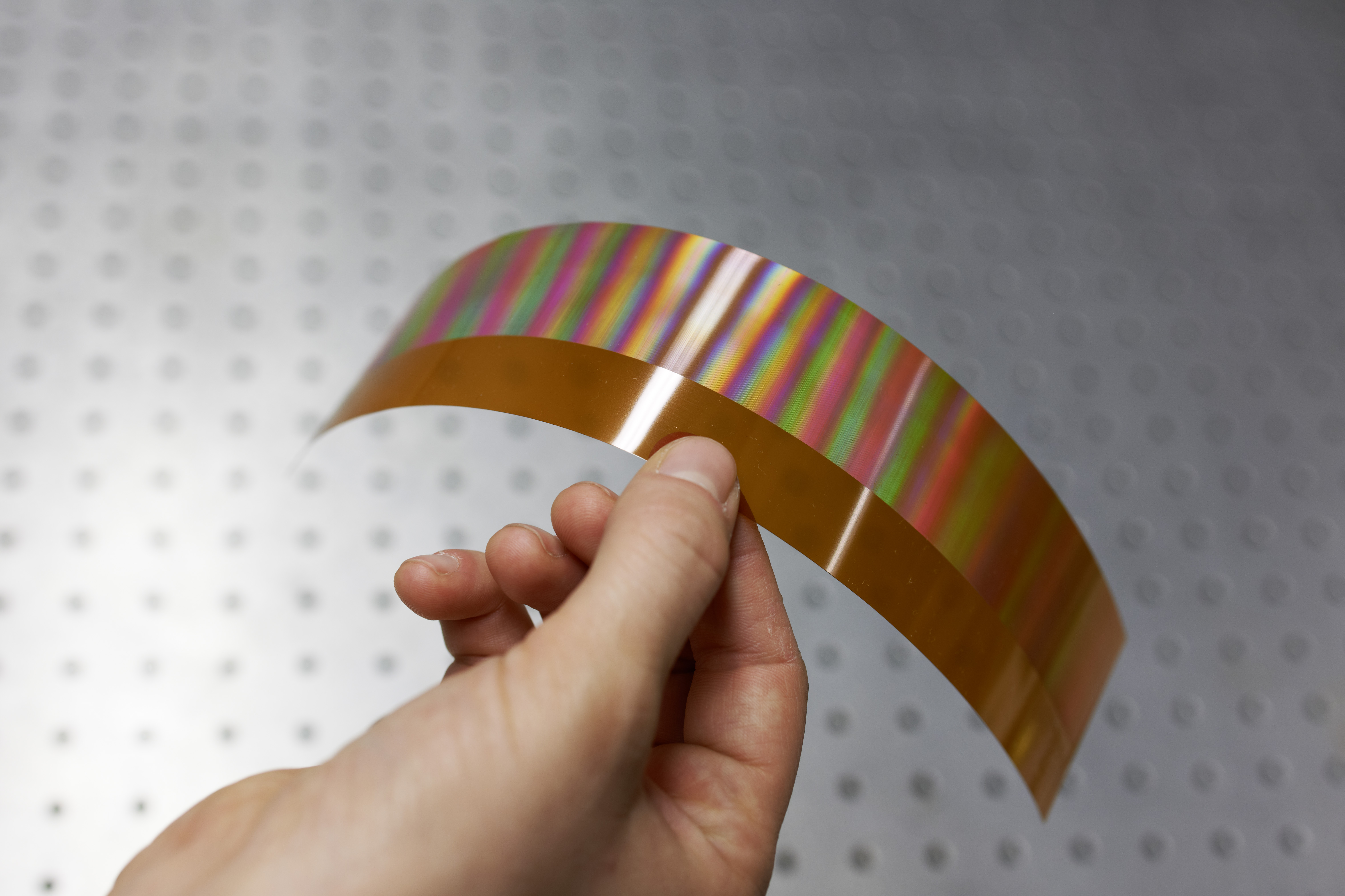 Polymer film, structured by means of laser interference technology