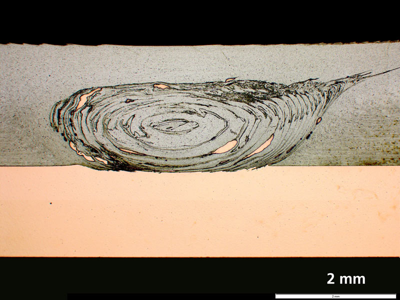 Cross section of an FSW weld seam in an overlap joint from aluminum and copper, etched