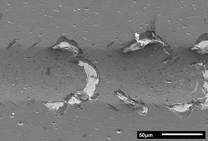 Detailled analysis of scratch test tracks yields information on adhesive and cohesive failure